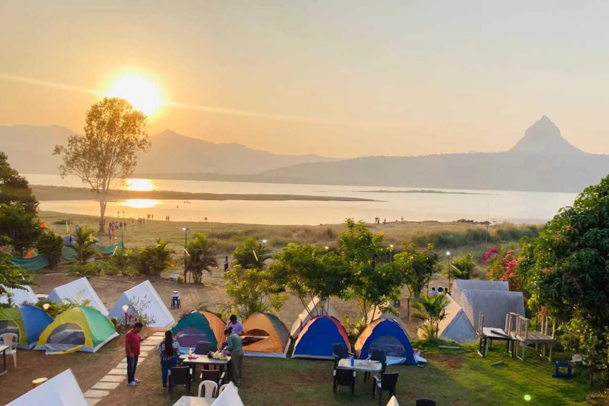 Camping tents at Pawna Lake with scenic views